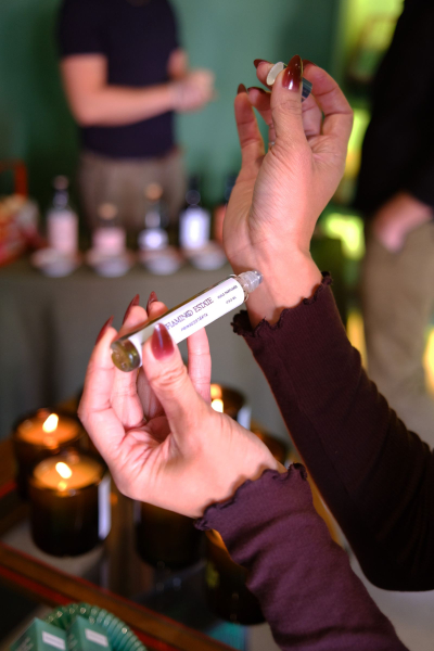 Shanna applying perfume oil